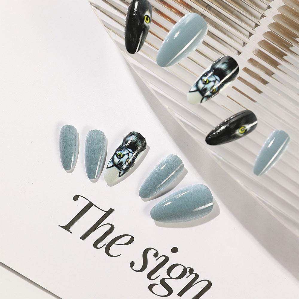 Mystical Feline Fantasy Medium Almond Shaped Sky Blue and Black Press On Nail Set with Unique Cat Eye Design