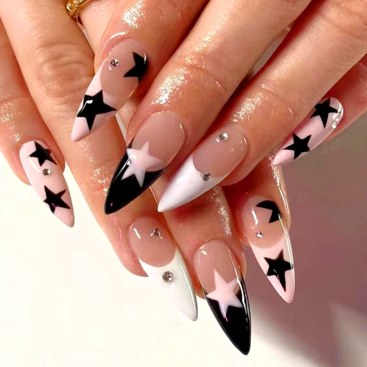 Celestial Glam Long Stiletto Press On Nails in Pink and Black with Star Designs and Rhinestone Accents