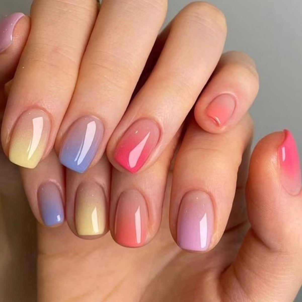Rainbow Dreams Short Oval Ombre Press On Nail Set in Pastel Pink Blue and Yellow with Shimmer Finish