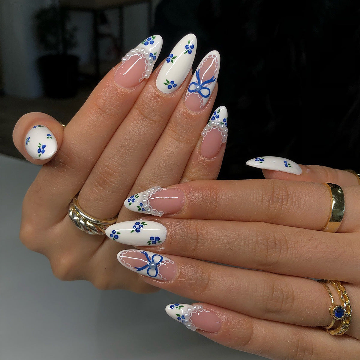 Whimsical Floral Dream Medium Almond Shaped White Press On Nail Set with Blue and Green Floral Accents