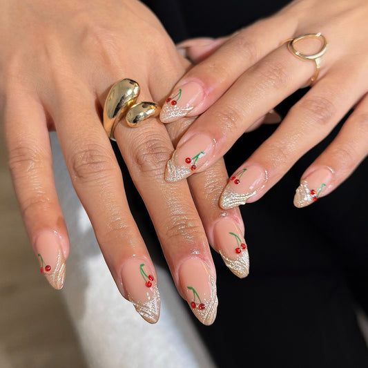 Cherry Blossom Dreams Medium Almond Beige Nails with Glittery Tips and Charming Fruit Accents