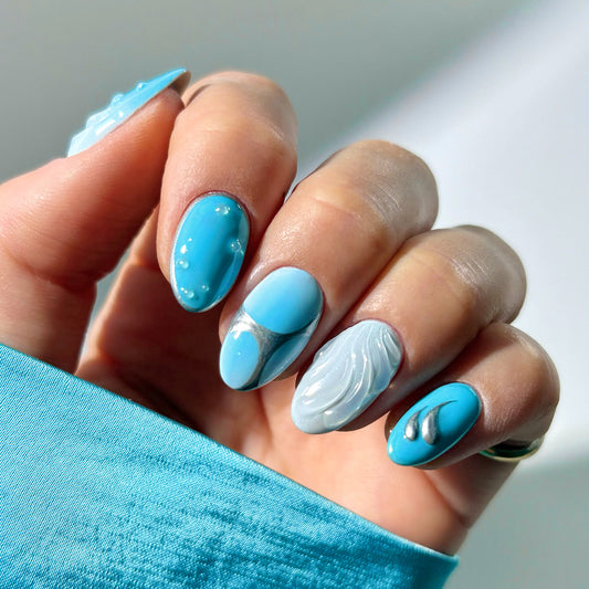 Ocean Breeze Short Oval Light Blue Nail Set with Unique Texture Details