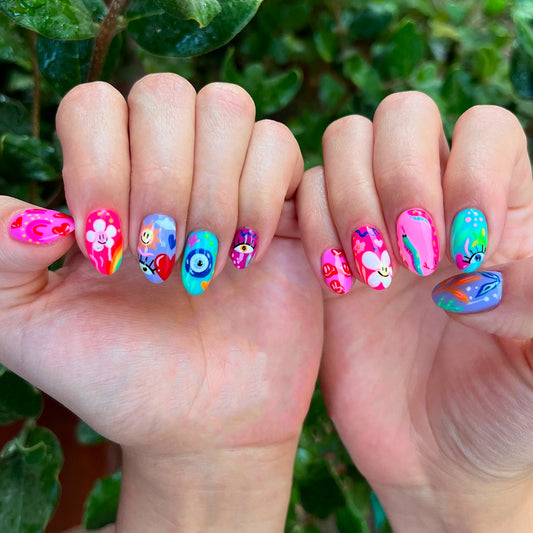 Whimsical Rainbow Press On Nail Set in Medium Almond Shape Multi-Colored with Artistic Floral Designs