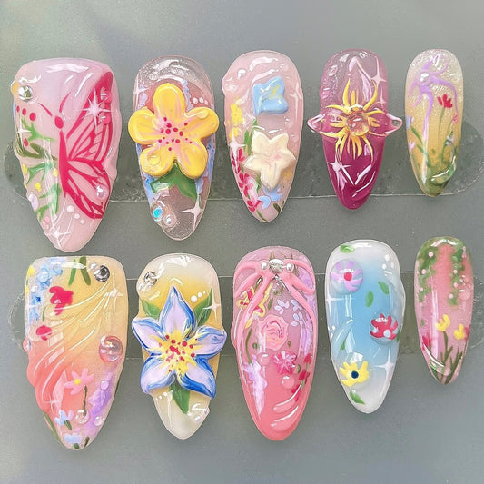 Set of colorful nail art designs on clear plastic sheets.