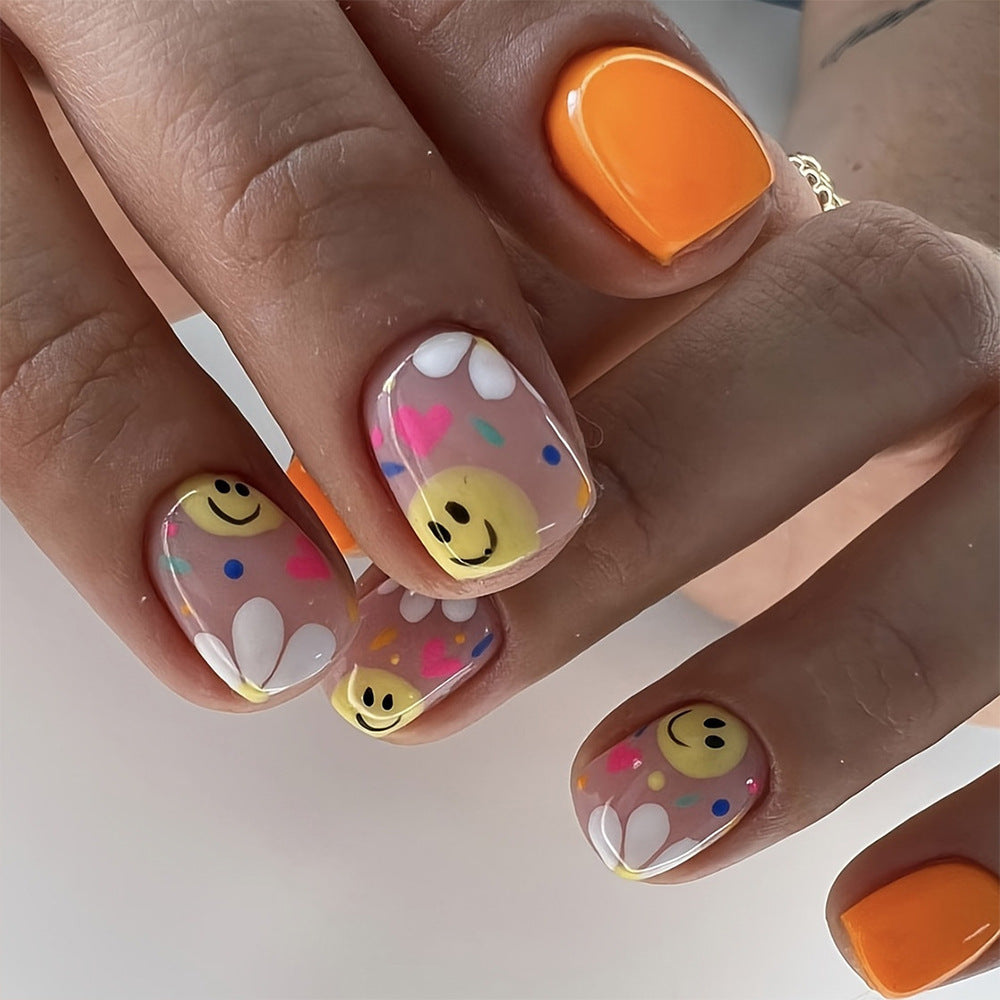 Cheerful Vibe Short Square Orange with Playful Smileys and Colorful Daisies Nail Set