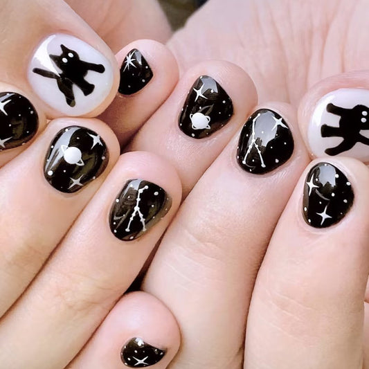 Celestial Night Theme Short Oval Black and White Press On Nail Set with Starry Universe Design