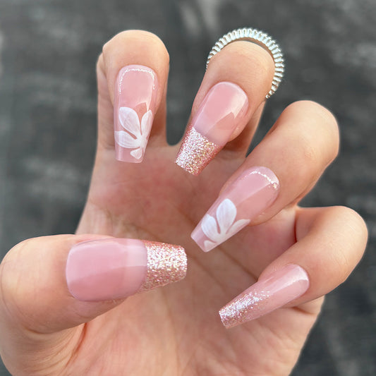 Floral Elegance Long Coffin Pink Glitter Press On Nail Set with Charming White Floral Design