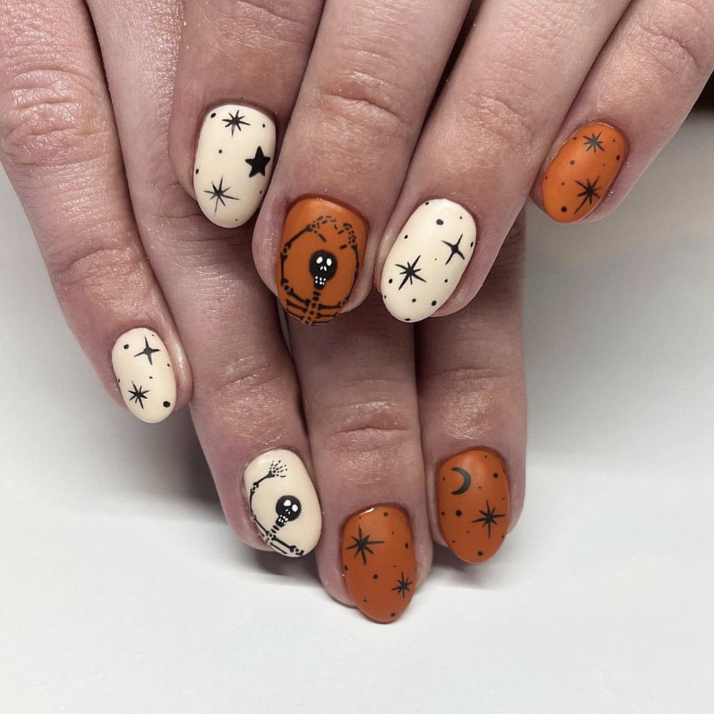 Spooky Halloween Oval Length Matte Orange and Cream Press On Medium Nail Set with Skull and Star Patterns