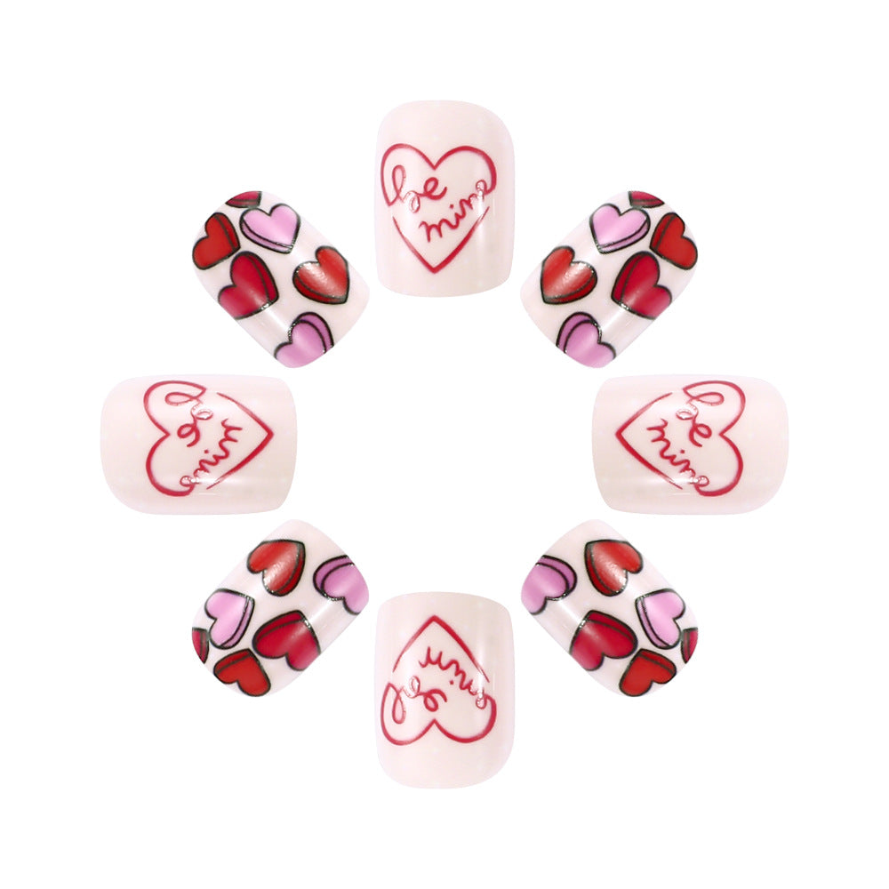 Set of heart-themed nail art designs on a white background