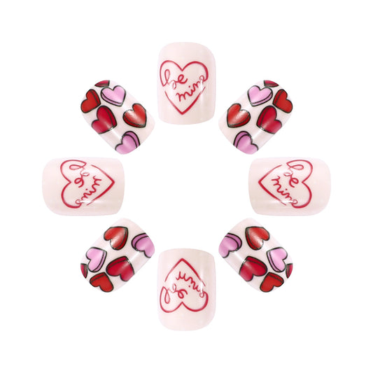 Set of heart-themed nail art designs on a white background
