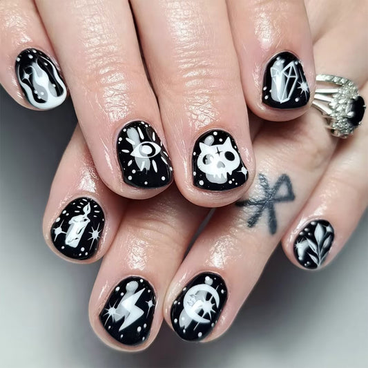Mystical Night Sky Short Oval Black and White Press On Nail Set with Unique Cosmic Designs