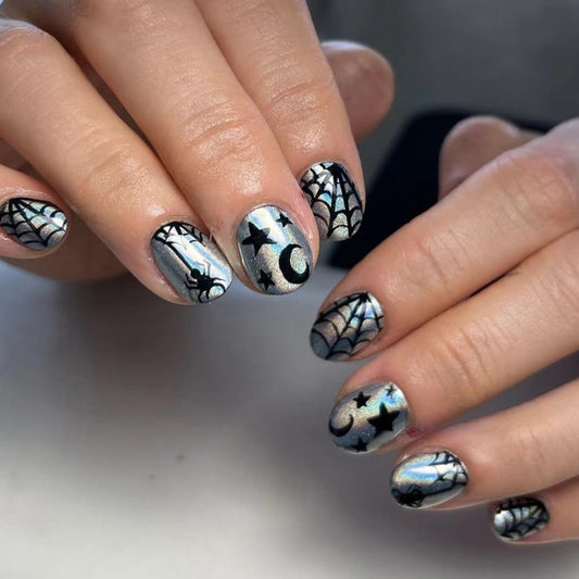A set of short press-on nails featuring a black and silver spider and web design, suitable for Halloween.