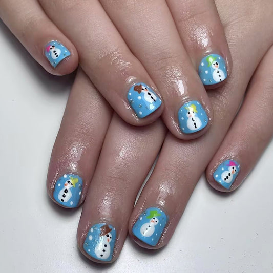Nails with snowman design on a white background