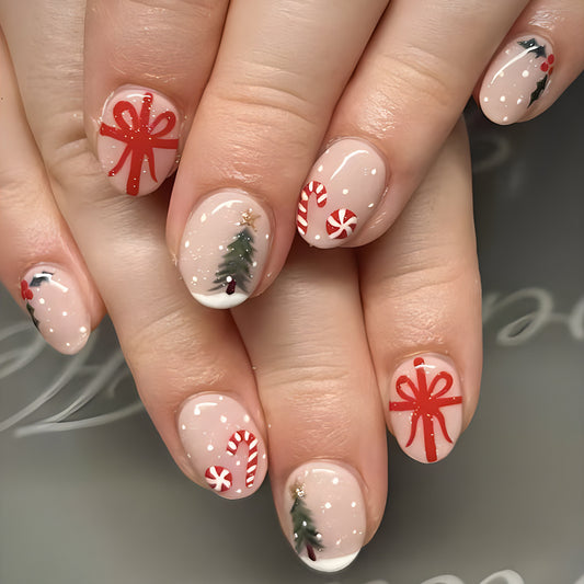 Close-up of hands with Christmas-themed nail art on a neutral background
