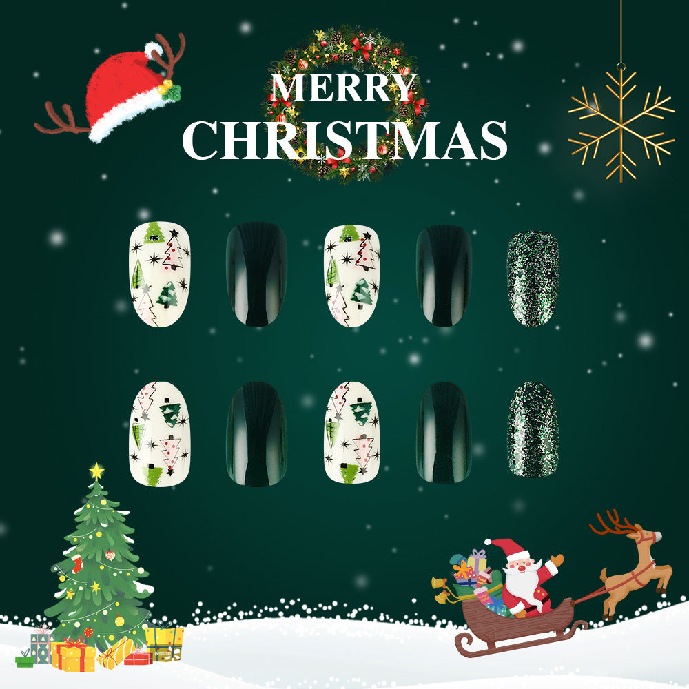 A set of press-on nails featuring a Christmas theme, including designs with reindeer, snowflakes, and Christmas trees in green, white, and multicolor.