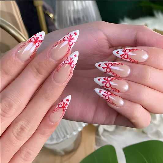 Chic Romance Medium Stiletto Press on Nail Set in Clear White and Vibrant Red with Charming Bow Accents