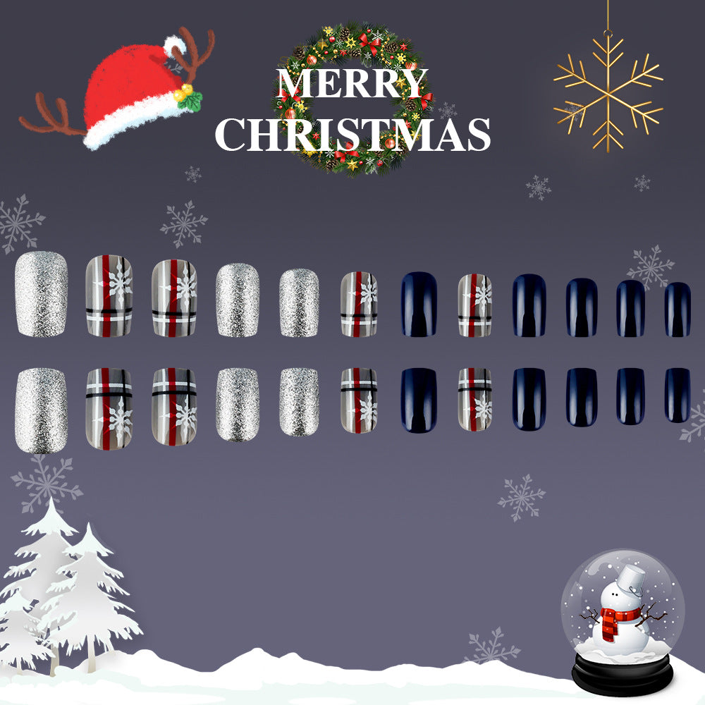 Collection of Christmas-themed nail art designs on a festive background with snowflakes, a wreath, and a snowman.