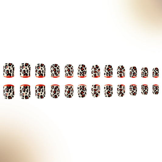 A set of false nails with a red and black leopard print pattern.