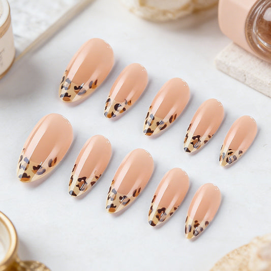 Savanna Sunset Medium Almond Peach Press on Nail Set with Unique Leopard Tip Design