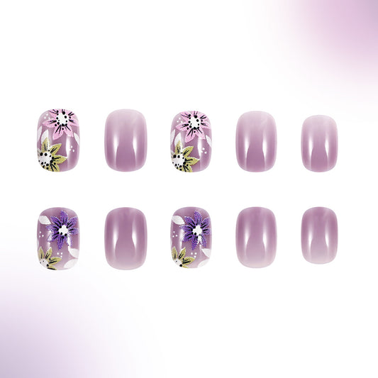 Set of purple nail art designs with floral patterns on a white background