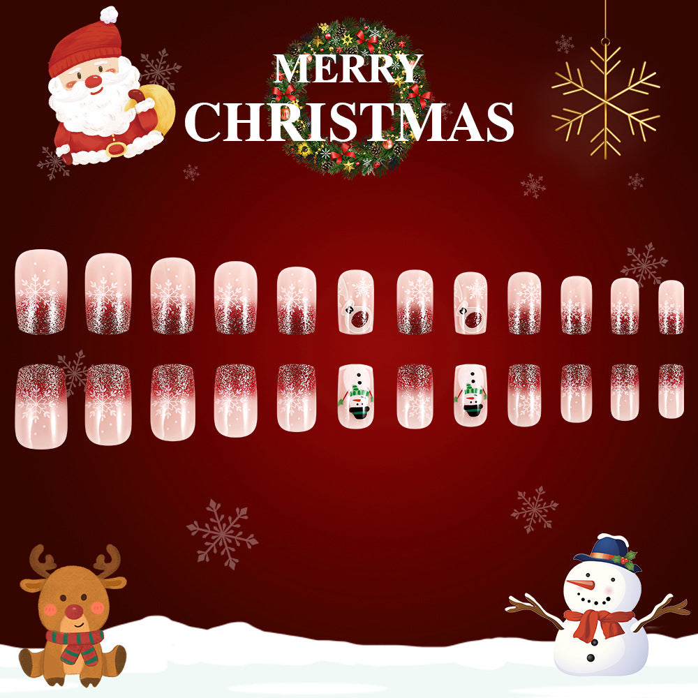 Christmas-themed nail art display with Santa Claus, reindeer, snowman, and snowflakes on a red background.