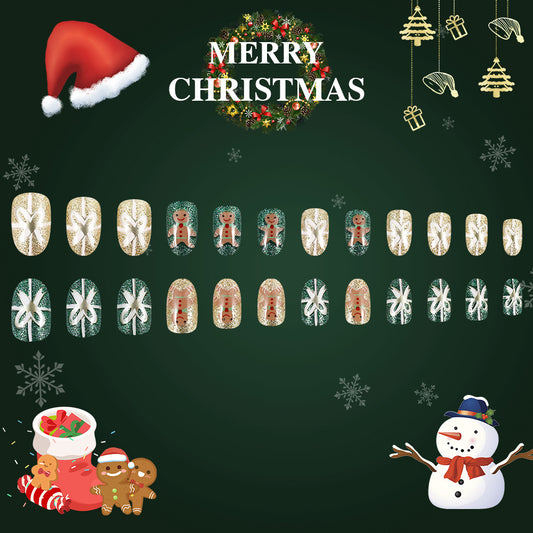 Christmas-themed nail art design with Santa hat, wreath, snowflakes, and gingerbread man on a dark green background.