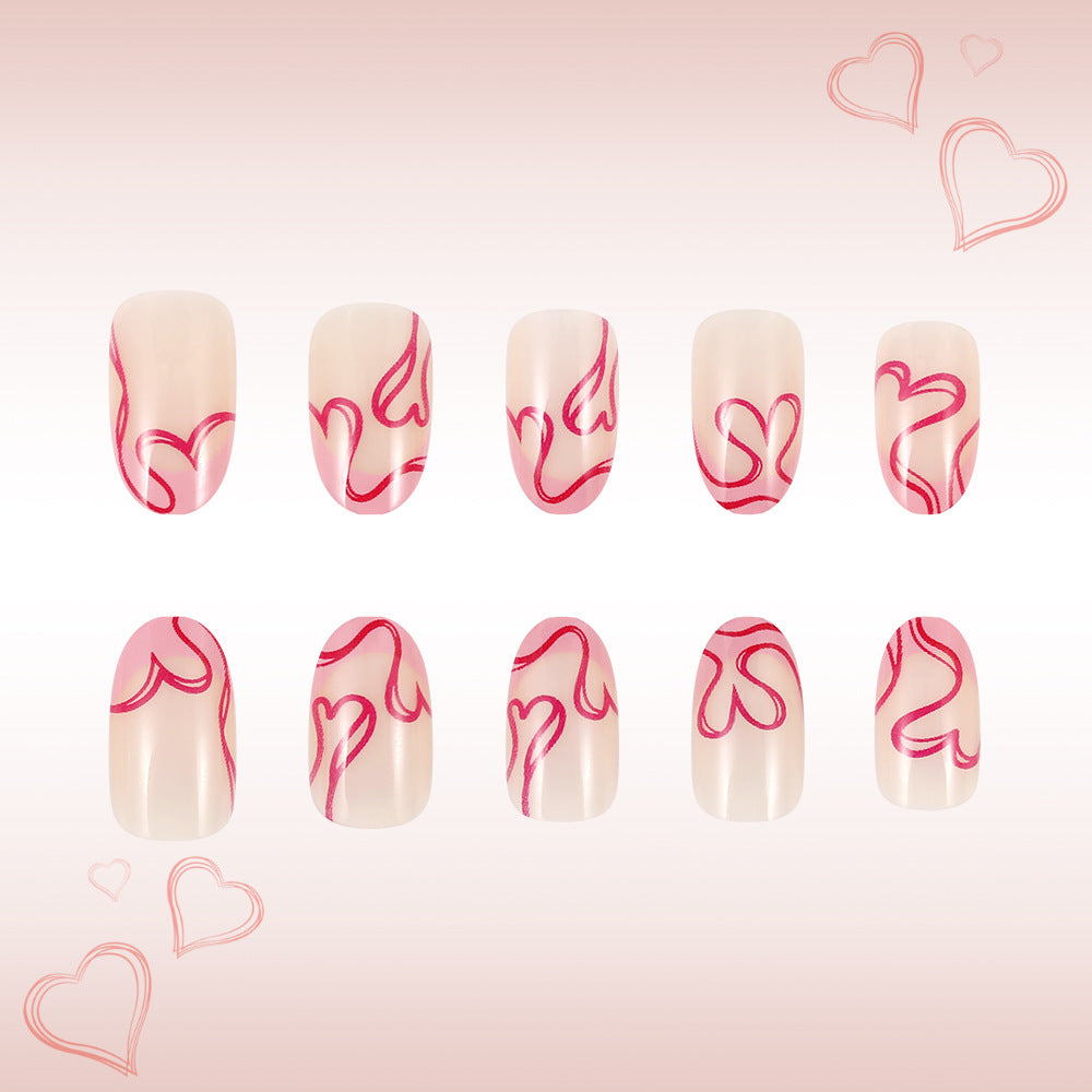 Romantic Heartfelt Medium Oval Pink Design Press-On Nail Set with Intricate Swirls