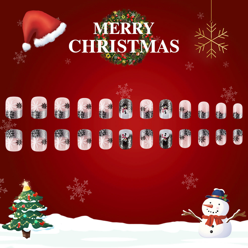 Nail art design set on a Christmas-themed background with Santa hat, wreath, snowflakes, tree, and snowman.