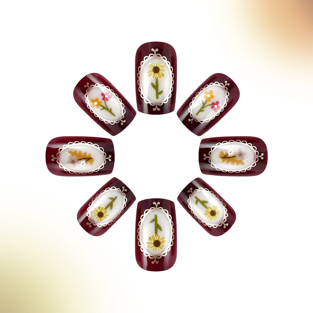 Rustic Charm Short Squoval Burgundy Floral Press On Nail Set with Delicate White Frame Design