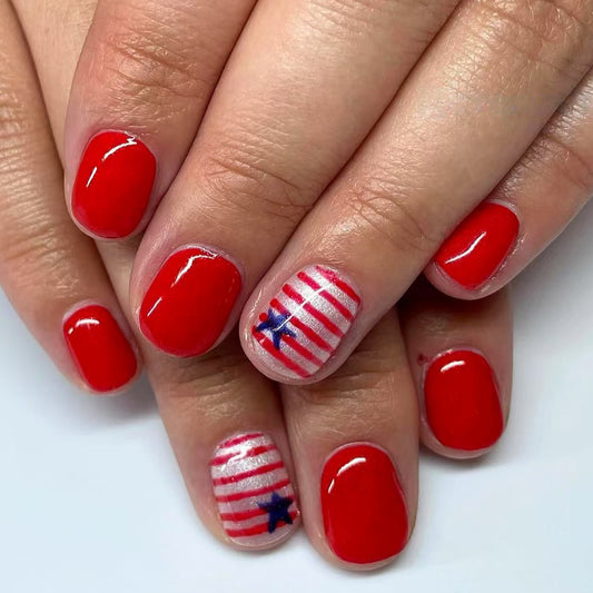 Festive Celebration Glossy Short Squoval Red Nail Set with Star and Striped Accent