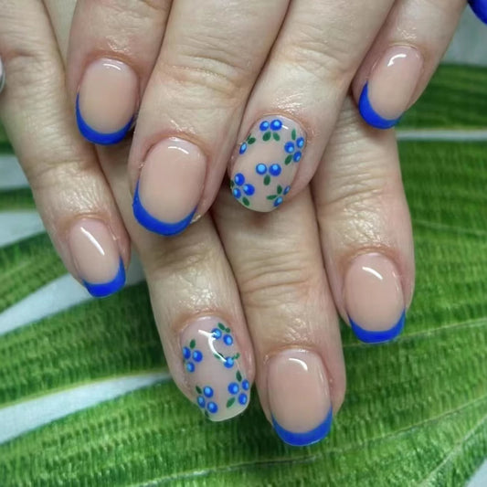 Tropical Dreamy Short Squoval Nail Set in Beige with Bold Blue French Tips and Floral Accents