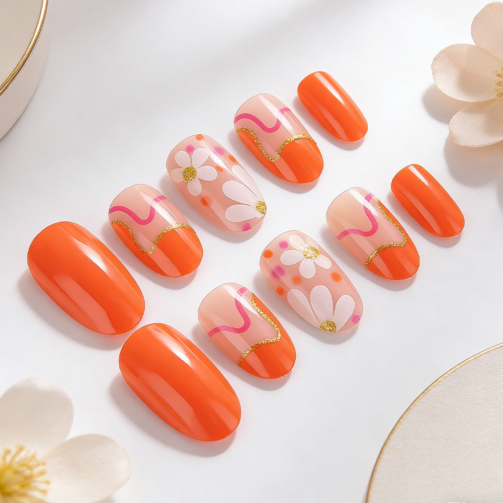 Floral Sunrise Medium Oval Shaped Orange Press On Nail Set with Daisies and Golden Accents