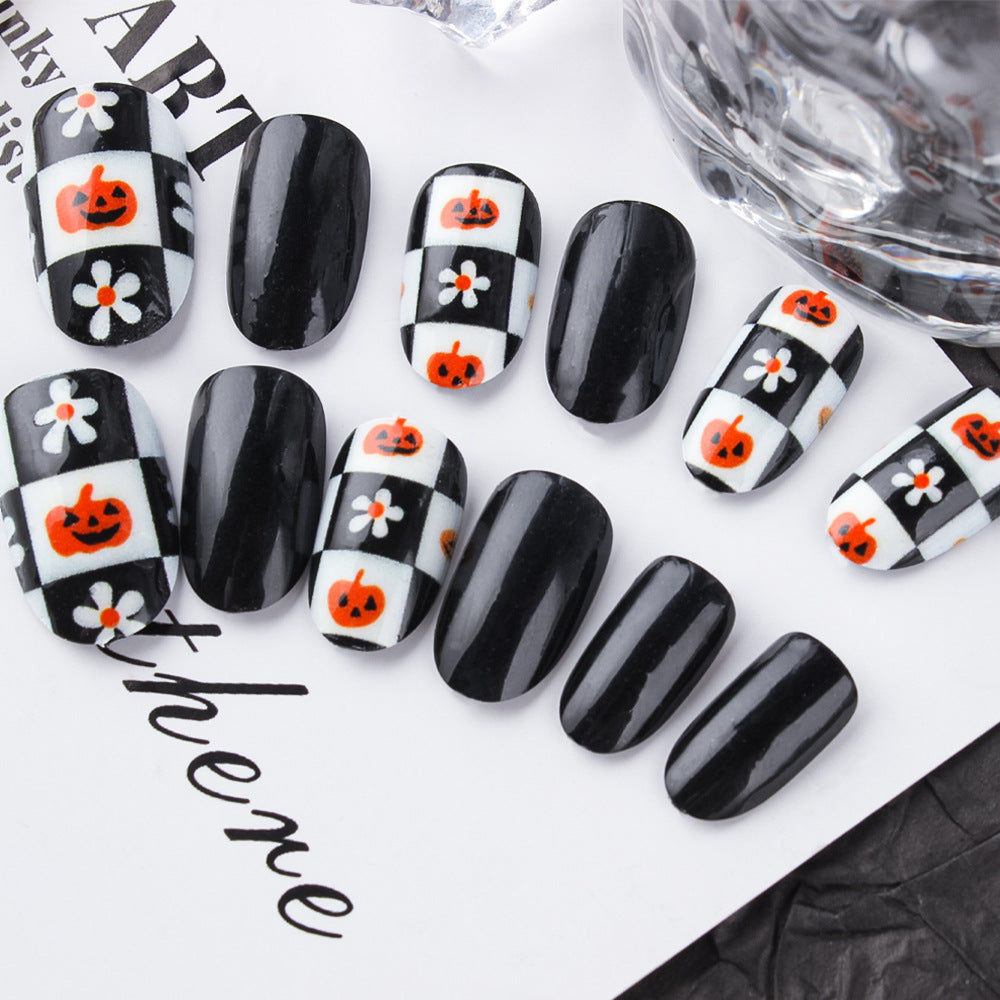 Spooky Halloween Black and White Short Oval Press On Nail Set Featuring Pumpkin and Flower Designs