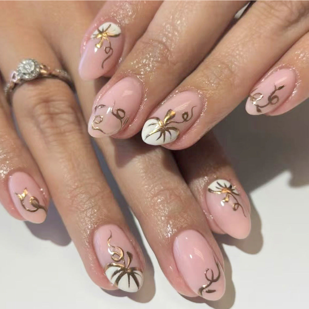 Glamorous Garden Inspired Medium Almond Pink and White Nail Set with Elegant Gold Floral Accents