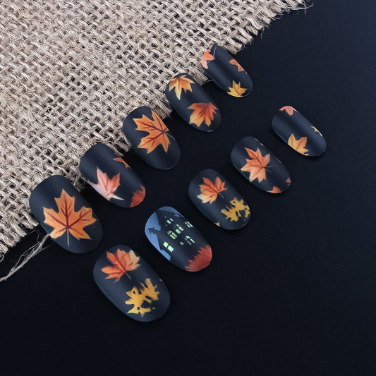 Autumn Whisper Medium Oval Matte Black Press On Nail Set with Unique Leaf Design
