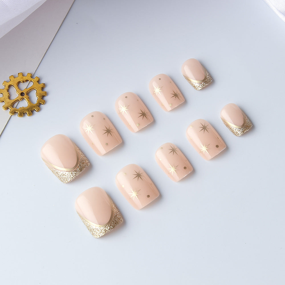 Celestial Elegance Short Square Soft Pink Nails with Glittering Gold Tips and Star Accents
