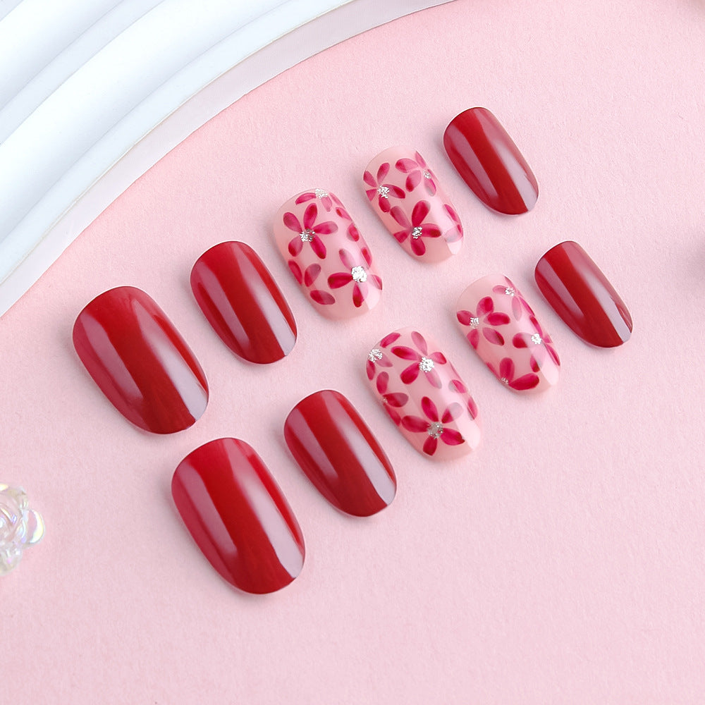 Elegant Floral Fantasy Medium Oval Deep Red with Floral Accents and Sparkling Rhinestones Press On Nail Set