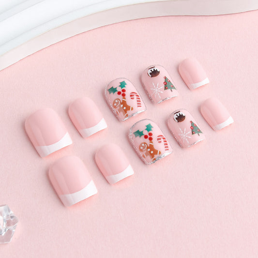 Set of pink nail wraps with Christmas designs on a pink background