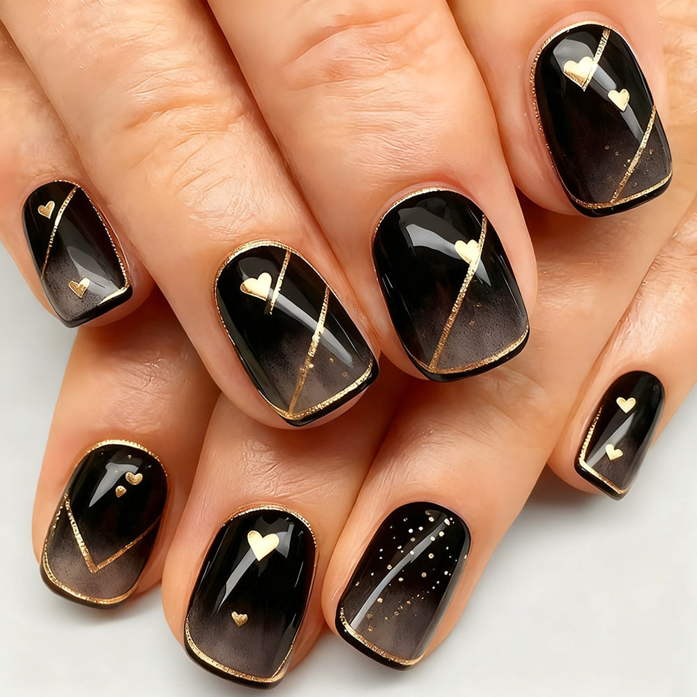 Elegant Evening Charm Black Short Square Press-On Nails with Gold Heart Accents and Shimmering Design