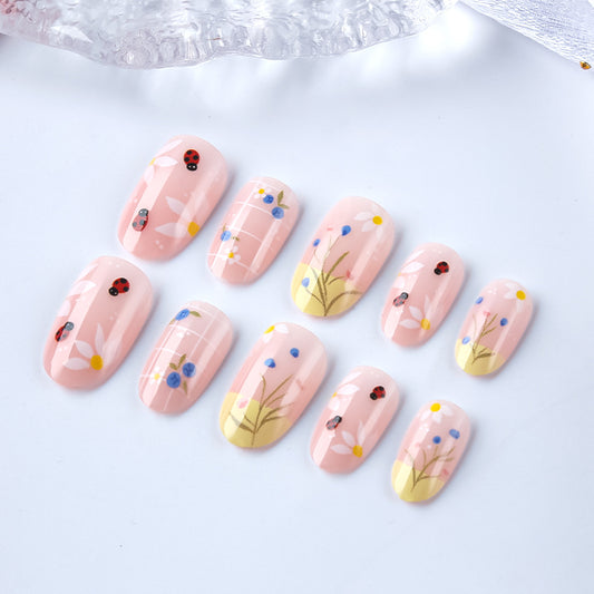 Blossom Delight Medium Oval Pink Press On Nail Set with Floral and Ladybug Design