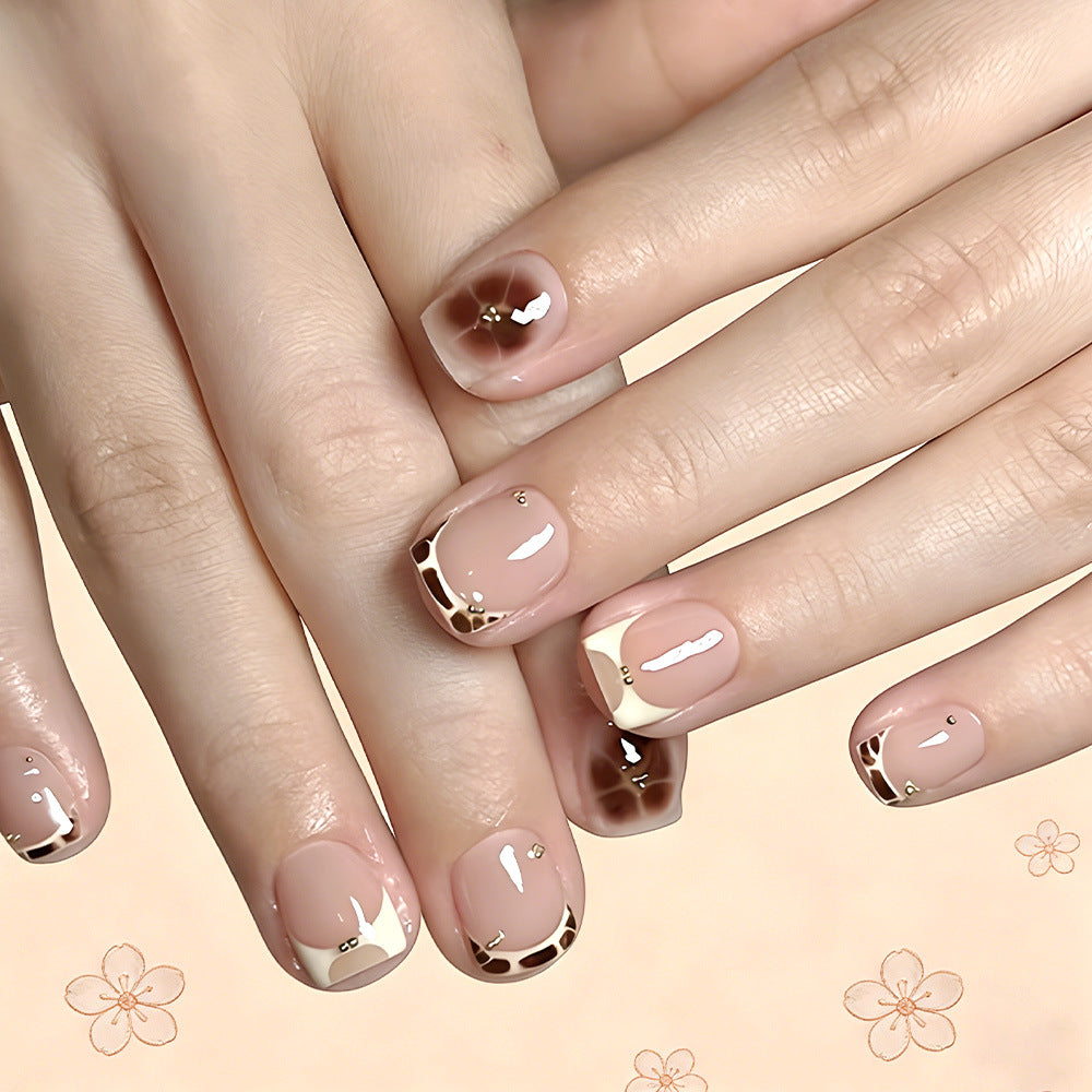 Elegant Garden Inspired Short Square Beige Nails with Artistic French Tips and Charming Gold Accents