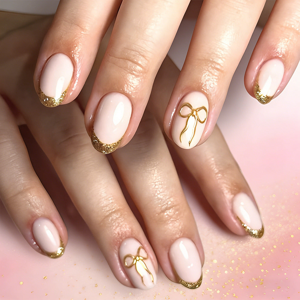 Charming Elegance Press On Nail Set Short Almond Blush Pink with Gold Glitter Tips and Cute Bow Accent