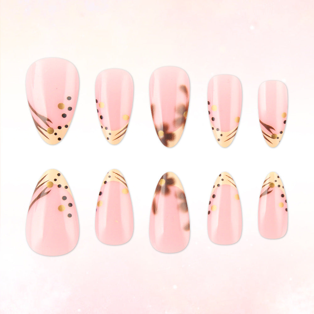 Blushing Elegance Medium Almond Pink Press On Nail Set with Unique Artistic Accents