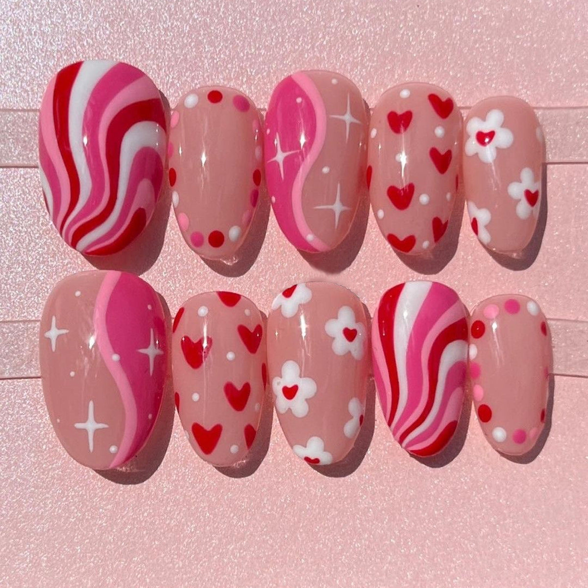 Romantic Swirls Short Almond Pink Nail Set with Heart and Flower Accents