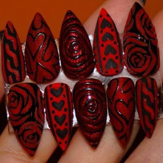 Romantic Elegance Medium Stiletto Red Nails with Intricate Black Designs