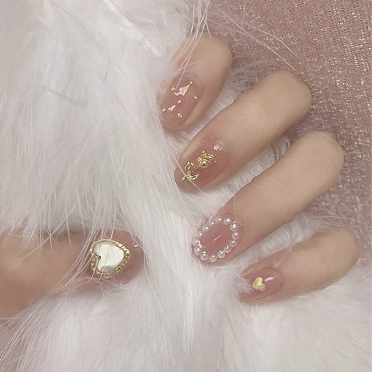 Enchanted Elegance Medium Length Oval Pink Press On Nails with Pearlescent Accents and Gold Flakes