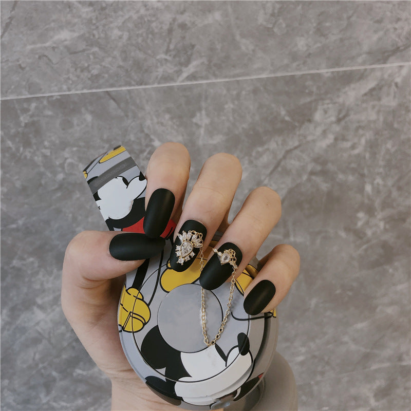 Cartoon Inspired Medium Oval Matte Black Press On Nails with Rhinestone Accents