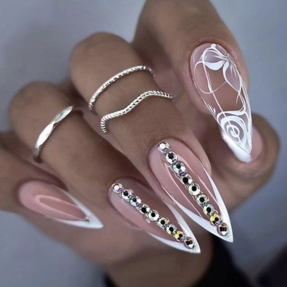 Elegant Romance Long Stiletto Pink Press On Nails with Rhinestone Accents and Artistic White Swirl Design