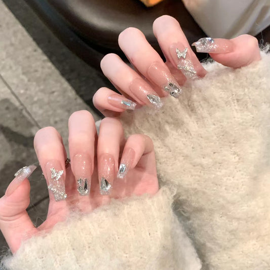 Enchanted Elegance Long Coffin Beige Press-On Nails with Silver Glitter Accents and Butterfly Appliques