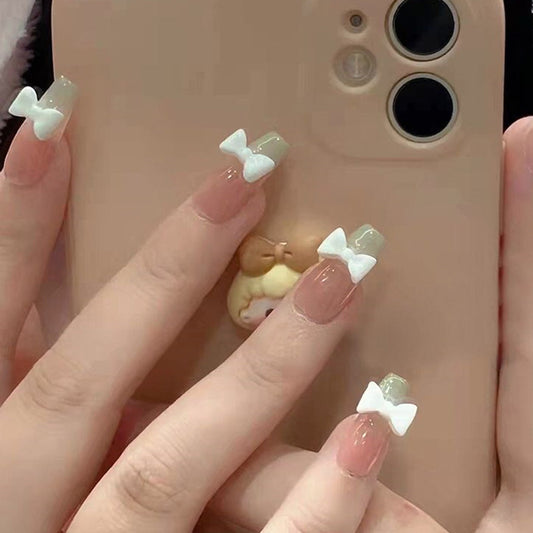 Enchanted Bow Collection Long Coffin Beige Press On Nails with White Bow Accents